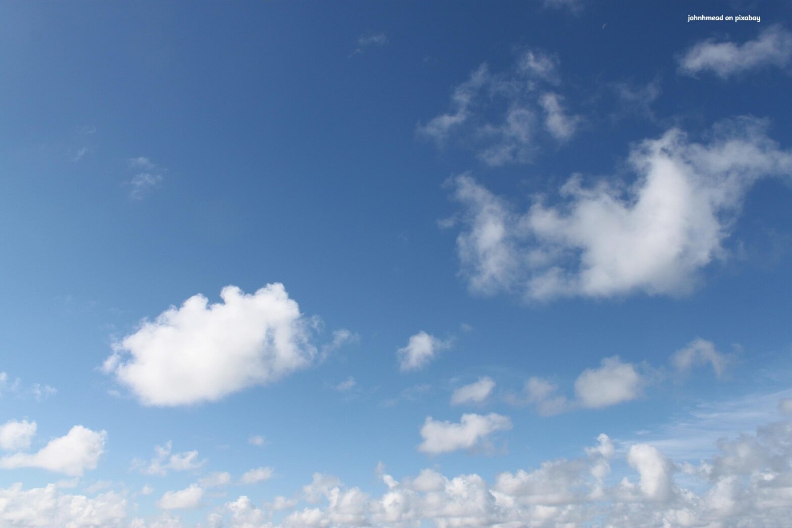 Soft blue sky with gentle clouds symbolizing calm awareness and emotional openness. Image by johnhmead on Pixabay.